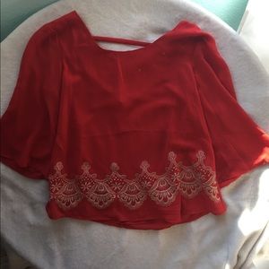 Orange top with gold embroidery